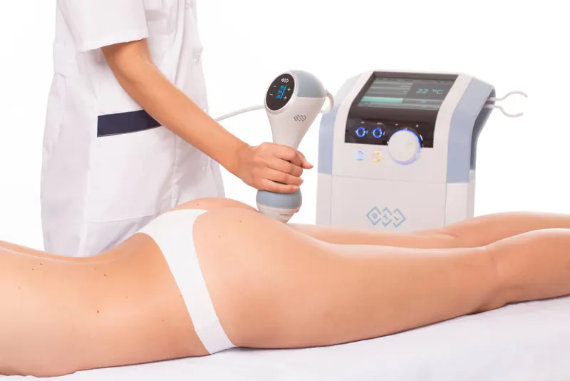 Practitioner using a genuine EMtone applicator on the glutes